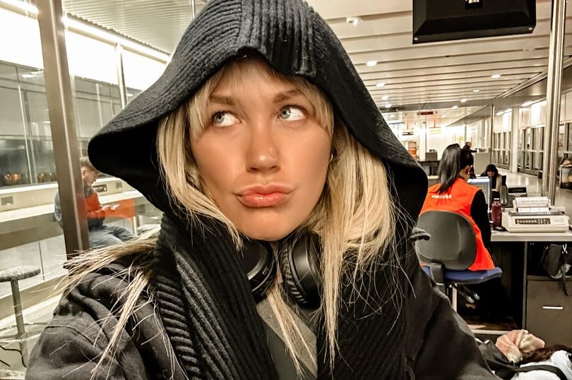 A Ryanair plane taking off from Birmingham Airport, with a focus on the airline's strict passport validity rule and its impact on passenger travel plans, ensuring safety and security for all passengers on board