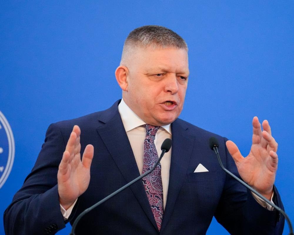 A gavel and a broken scale of justice, symbolising the erosion of the rule of law in the EU, with a European flag in the background, highlighting the need for urgent action to protect democracy and human rights