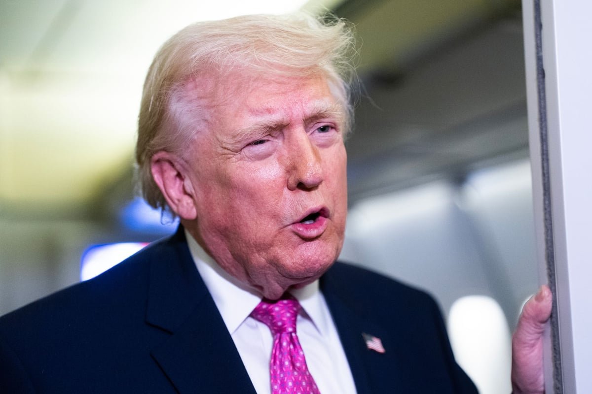 Protesters in Belarus hold signs condemning Lukashenko's regime, as the international community criticises Trump's praise of the authoritarian leader