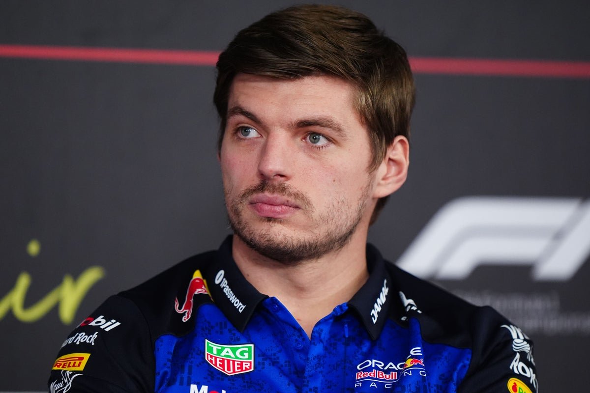 Max Verstappen in his racing car, with a focused expression, amidst a colourful racing atmosphere, with Martin Brundle's comments sparking controversy in the background