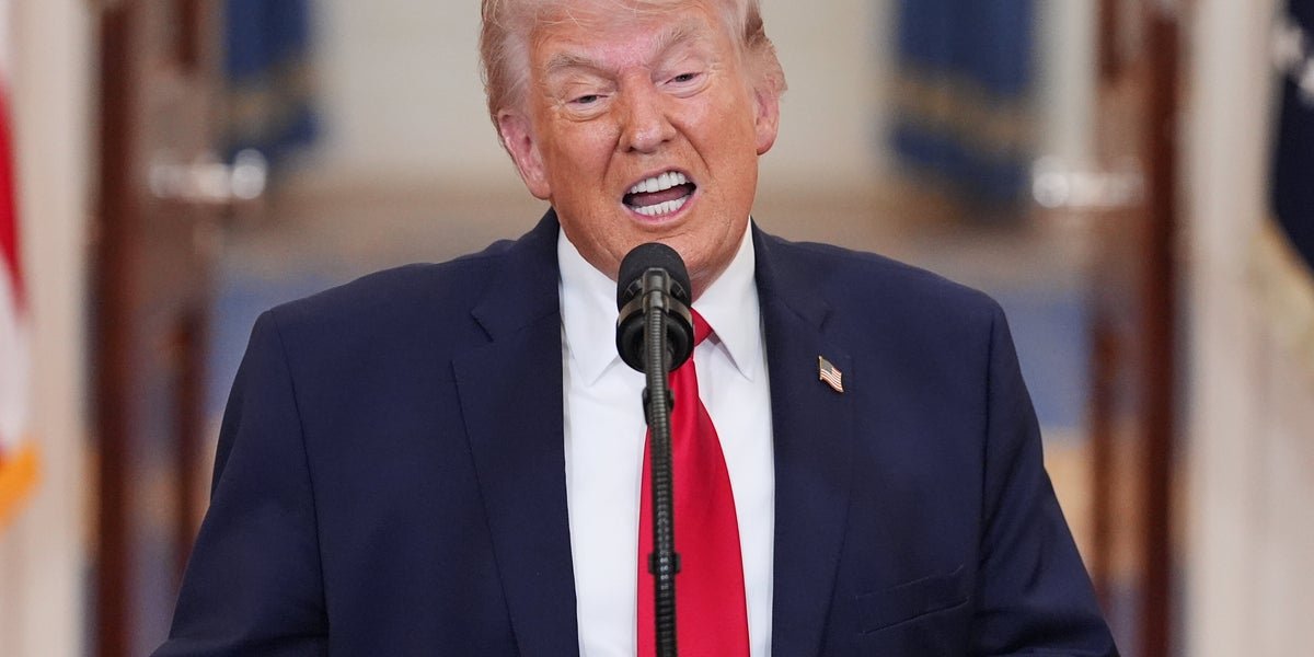 Donald Trump speaking at a press conference, with a serious expression, as a former Pentagon official compares his behaviour to 'a drunk' over Iran war outbursts, highlighting the need for a more measured and thoughtful approach to international relations and diplomacy