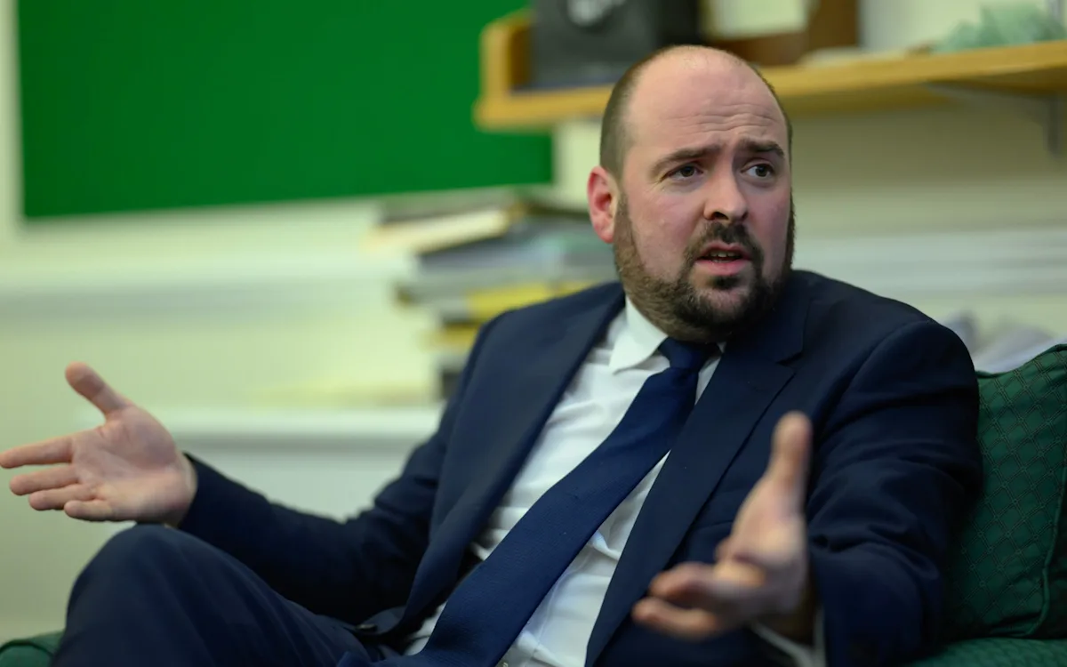 A scenic view of a motorway with a speed limit sign, highlighting the Greens' proposal for a 55mph motorway speed limit to reduce carbon emissions and promote sustainable transport