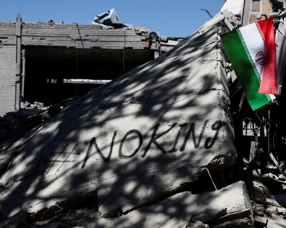 A train station in Iran, with a sign reading 'danger' in the foreground, symbolising the risk to life warned by Israel, as the Trump deadline approaches and the Middle East conflict escalates