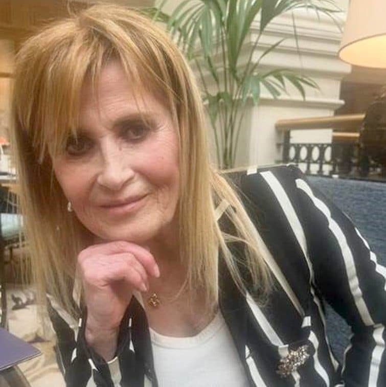 A woman in a courtroom, with a bandaged neck and a look of shock, symbolising the devastating consequences of sibling violence and the importance of conflict resolution, with a Rolex watch in the foreground
