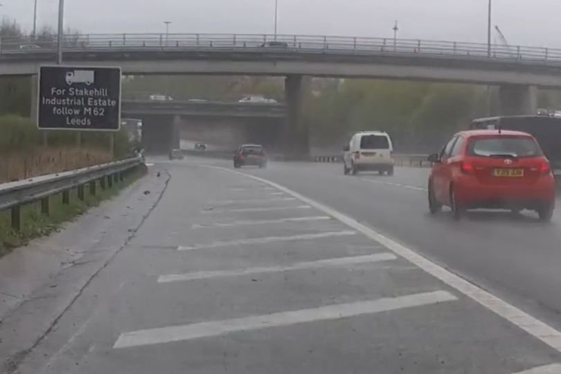 A BMW being pursued by police vehicles along the M60 motorway, with a dashcam capturing the high-speed chase, highlighting the importance of road safety and responsible driving