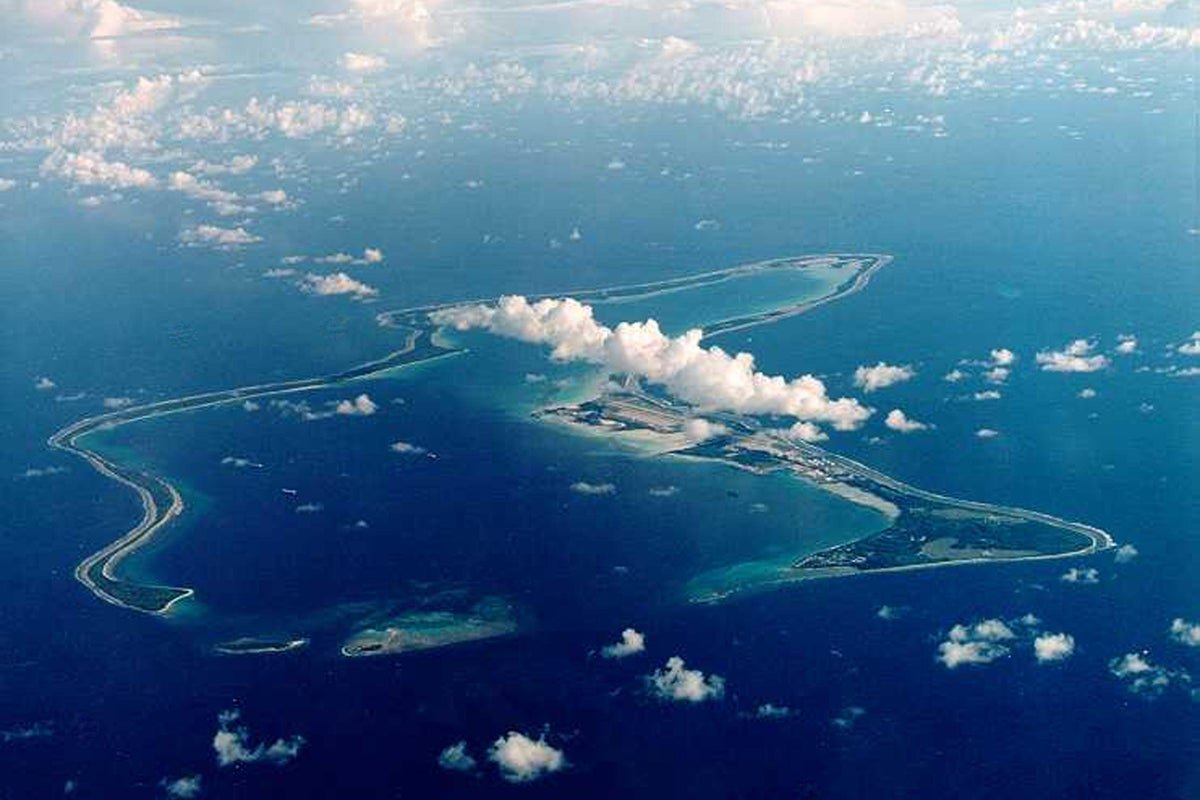 Aerial view of the Chagos Islands, with a focus on the natural beauty and unique ecosystem of the archipelago, highlighting the importance of preserving the environment and promoting sustainable development, as the UK government considers resettlement plans and the potential impact on the island's behaviour and relationships with neighbouring countries
