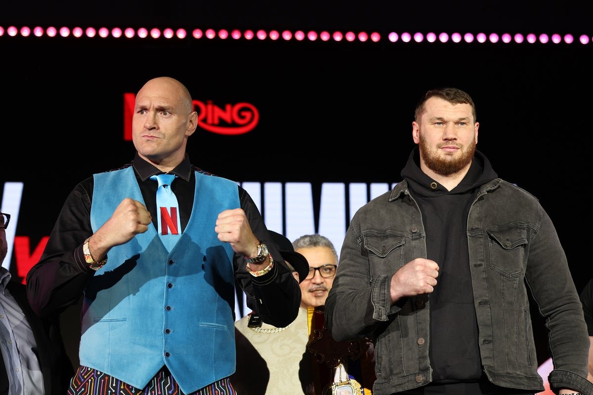 Fury and Makhmudov face off in the ring, with the crowd cheering in the background, as they prepare for their highly anticipated boxing match, with the fighters' intense behaviour and colourful personalities on full display
