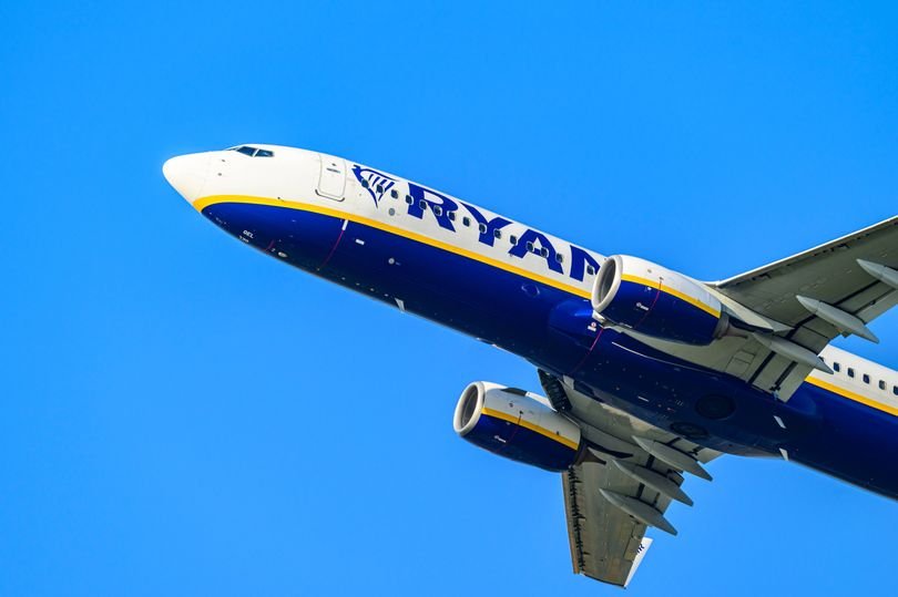 A Ryanair plane in flight, with a description of the medical emergency that led to the U-turn back to the UK, highlighting the airline's commitment to passenger safety and well-being, with a focus on the primary keyword phrase 'medical emergency'
