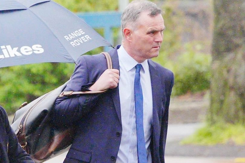 A photo of a horse trainer standing in a field, with a dog walker in the background, highlighting the importance of animal welfare and responsible behaviour in public spaces, with a focus on the primary keyword phrase 'horse trainer sentenced'