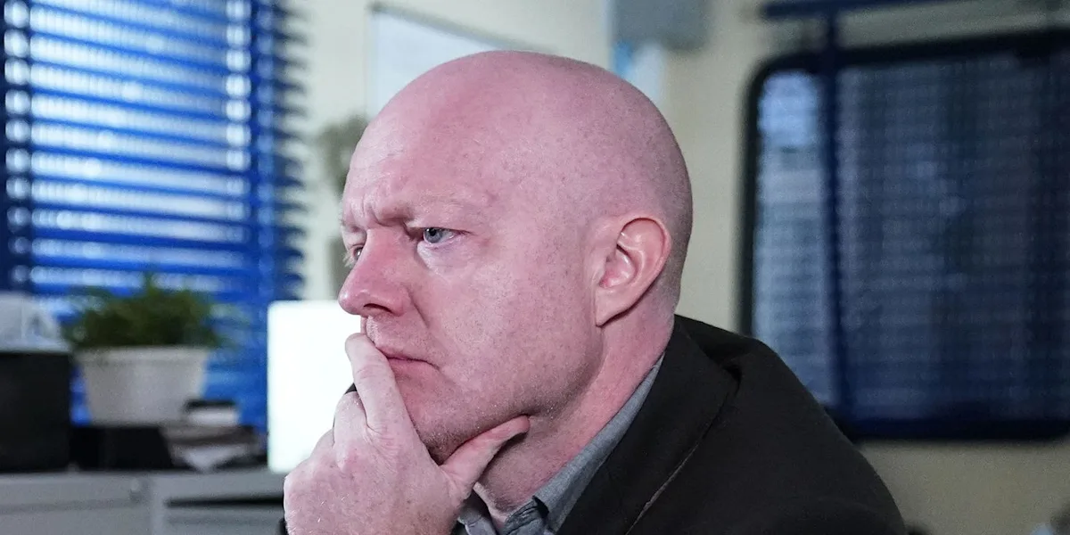 The Branning family standing together, looking worried and tense, with a city landscape in the background, representing the EastEnders soap opera and the Branning family's latest battle