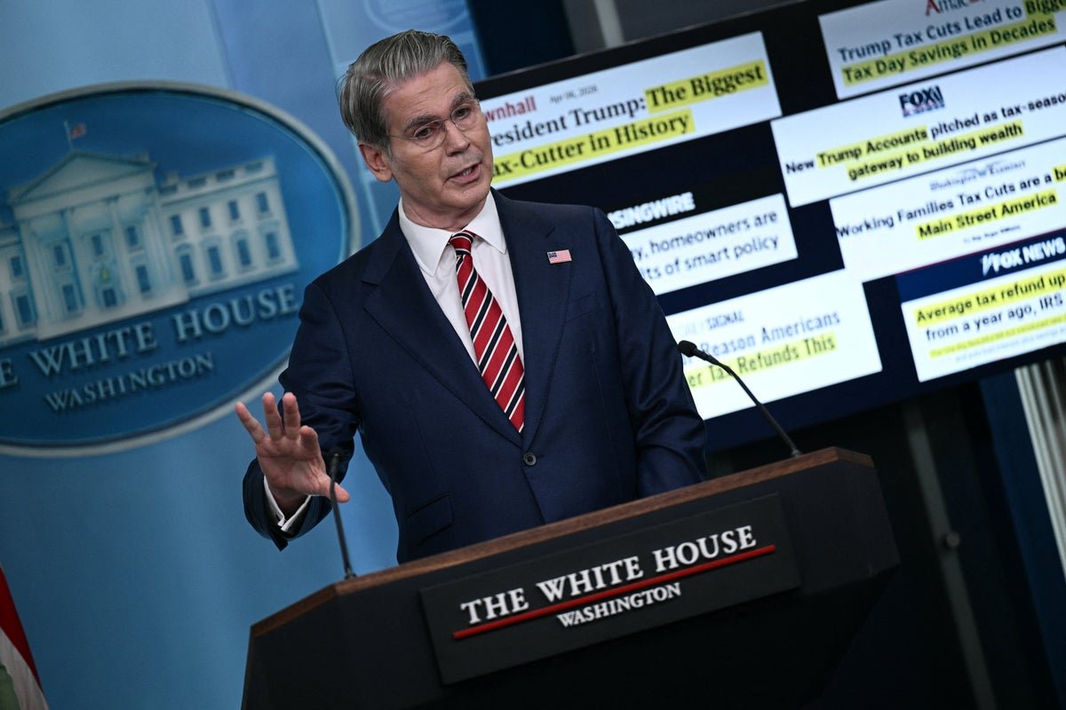 US flag waving in the wind, with a subtle background image of the White House, representing the country's political landscape and the ongoing debate about the Iran war and US foreign policy