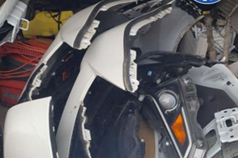 Image of a car with a stolen sign on it, with a blurred background of a football stadium, the primary keyword being car thieves at Blues matches