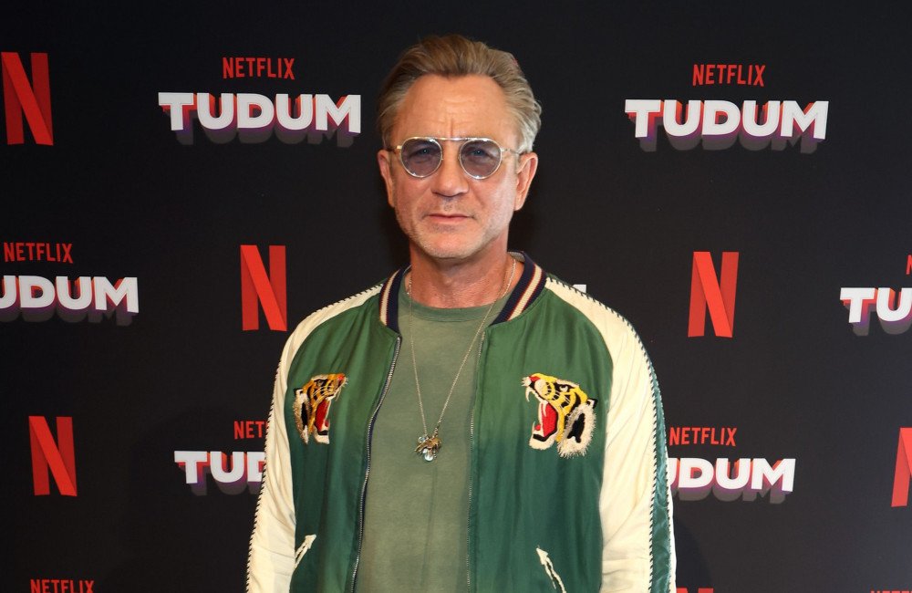 James Bond film set with actors and crew members, highlighting the latest casting update and production details, featuring the iconic James Bond character and his sophisticated style