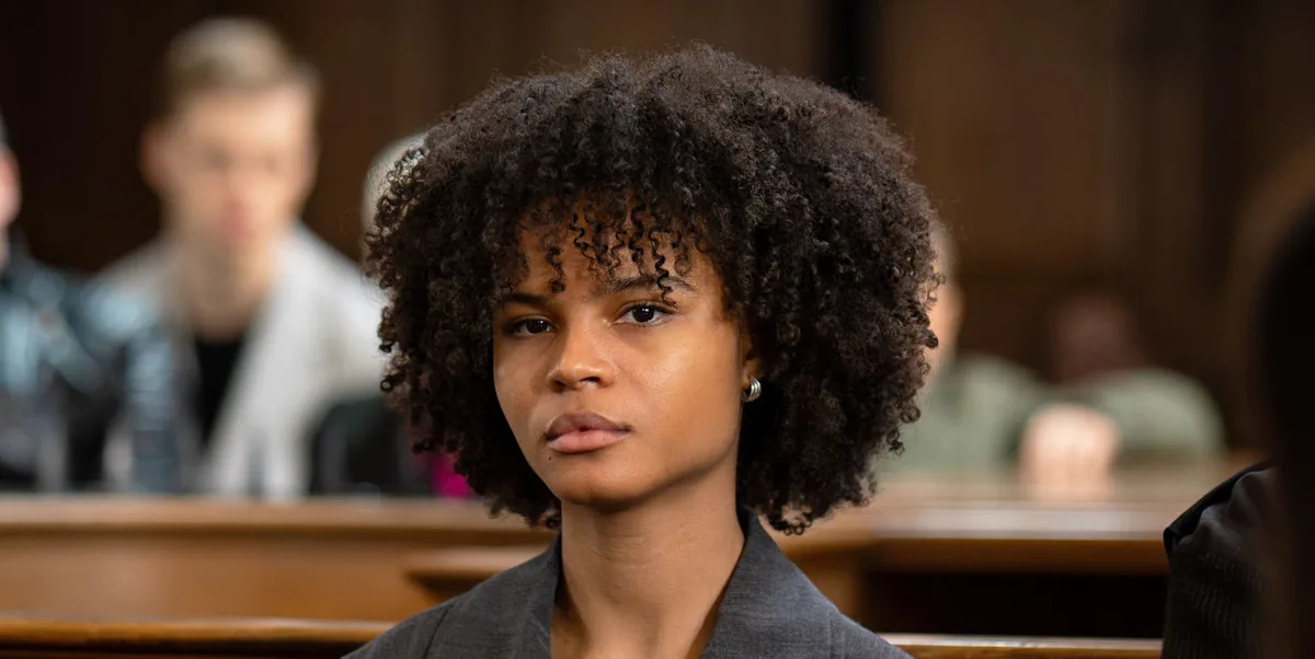 EastEnders character Jasmine Fisher with a shocked expression, symbolising the deadly secret that's been exposed in the latest episode, available to stream now on iPlayer