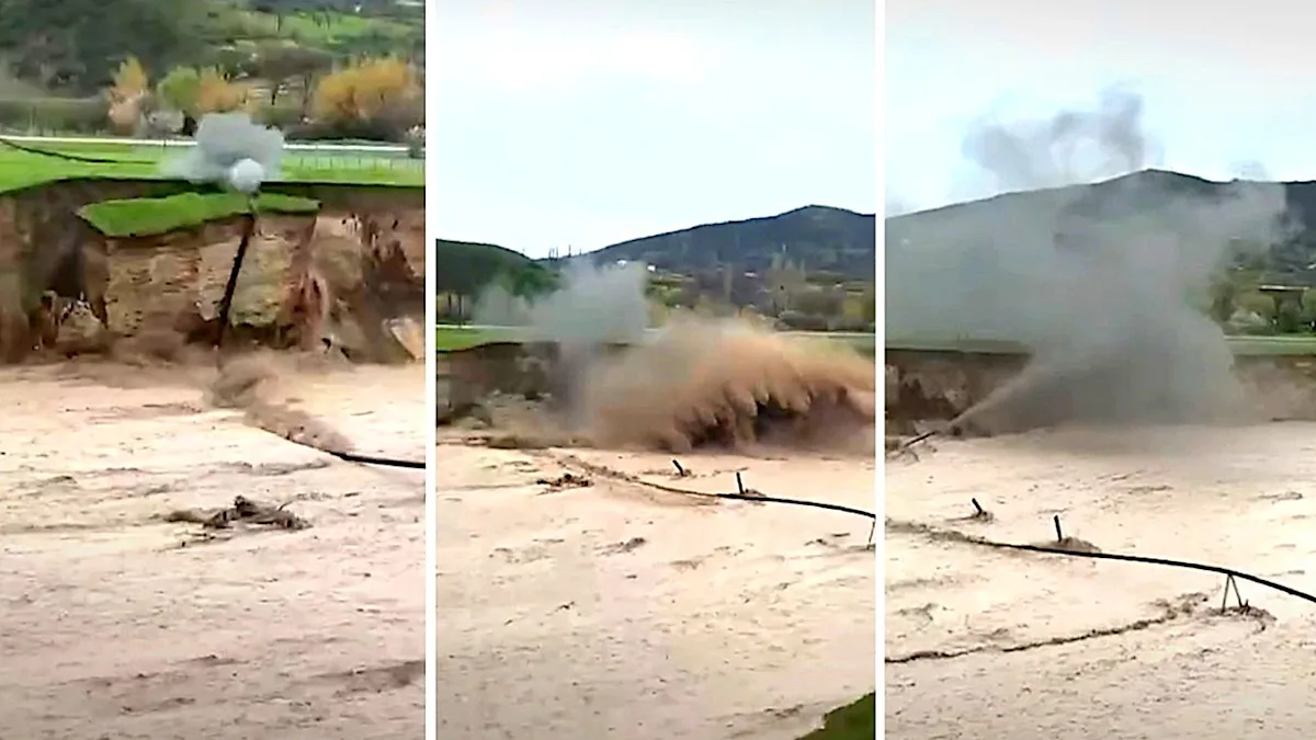 Aerial view of the floods and landslides in Dagestan, with a damaged gas line and destroyed buildings, the colour of the sky is a deep grey and the overall atmosphere is one of devastation and destruction, the primary keyword is floods and landslides