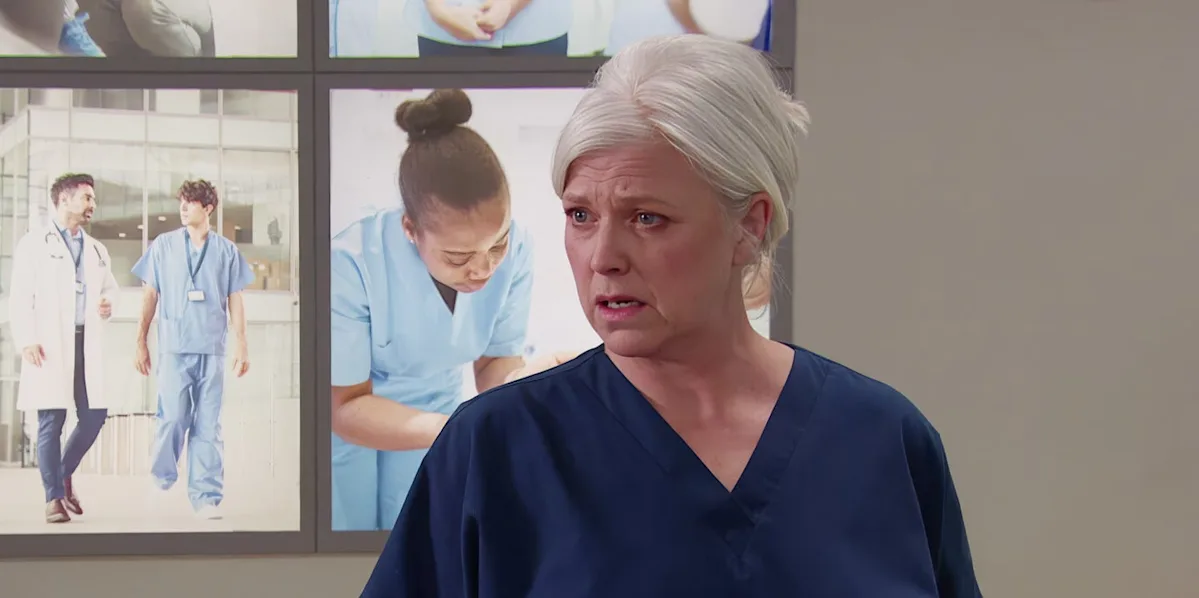 A dramatic scene from Emmerdale featuring Dr Todd's explosive outburst, with the village in the background and a mix of shocked and concerned expressions from the residents, as they analyse his behaviour and the consequences of his actions