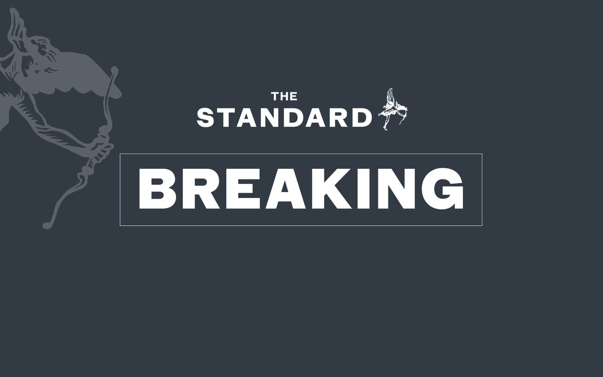 A burnt-out building in Hendon, north London, after an arson attack on a Jewish business, with police officers and firefighters at the scene, highlighting the devastating impact of hate crime on local communities