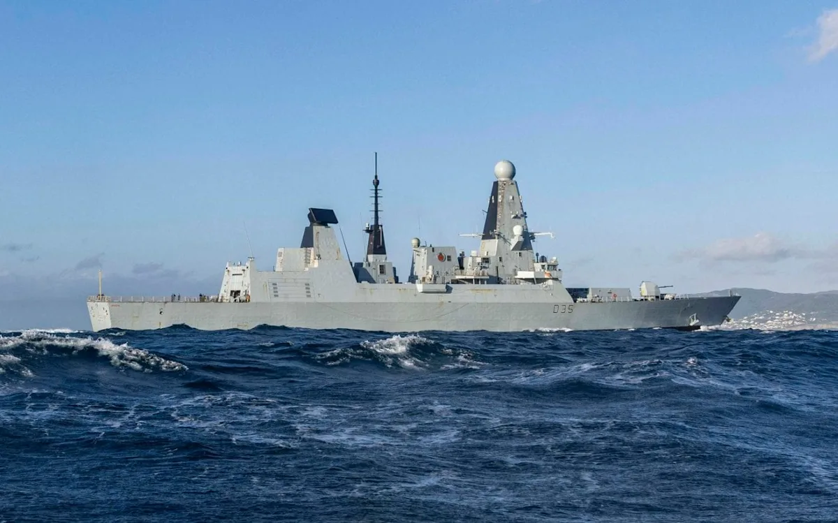 The HMS Dragon, a Type 45 destroyer, sails through choppy waters, its advanced radar and missile systems on full display, a testament to the Royal Navy's commitment to safety and readiness, with the primary keyword being HMS Dragon