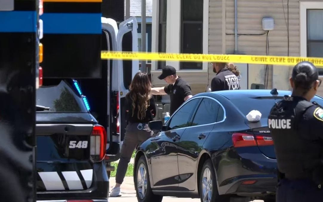 A memorial for the victims of the Louisiana mass shooting, with flowers and candles surrounding a photograph of the children who lost their lives in this tragic incident, highlighting the need for increased awareness and education about gun safety and mental health issues.