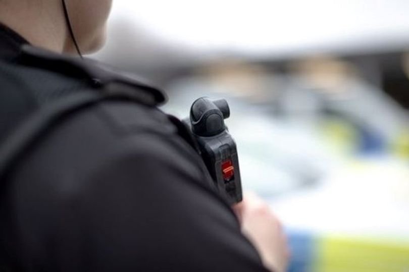 A sombre image of a memorial for the victim of the unlawful killing in Bedminster, with flowers and candles surrounding a photograph of the victim, highlighting the tragic incident and its impact on the community, with a focus on mental health and behaviour