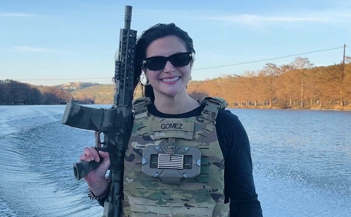 A photo of a person holding a sign that reads 'No to Hate Speech' with a crowd of people in the background, the primary keyword 'hate speech' is visible on the sign, highlighting the importance of tackling this issue
