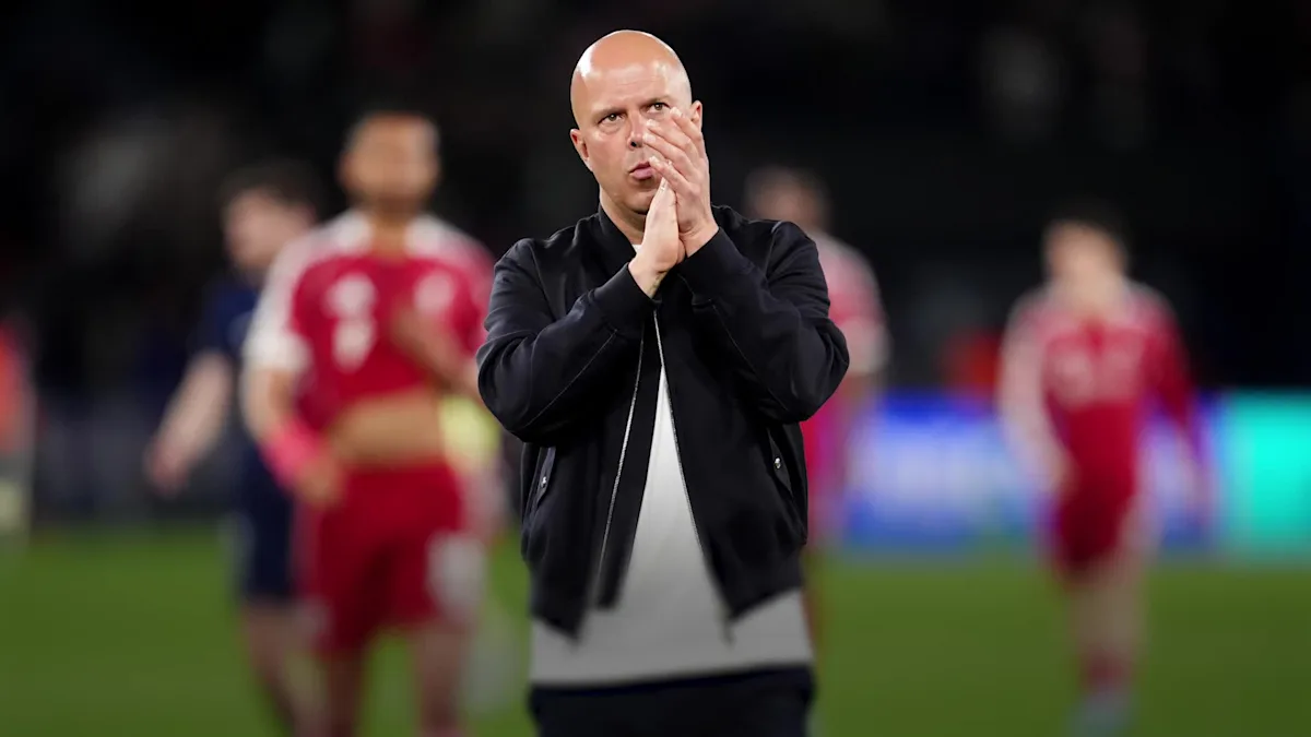 Liverpool players in action at Anfield, with the crowd cheering them on, as they look to spark another Champions League comeback