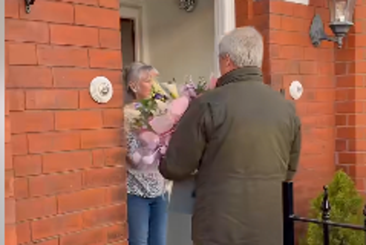 A photograph of a person holding an unpaid energy bill, with a confused and worried expression, highlighting the struggles of households dealing with rising energy costs and the importance of transparency and accountability in initiatives aimed at helping them