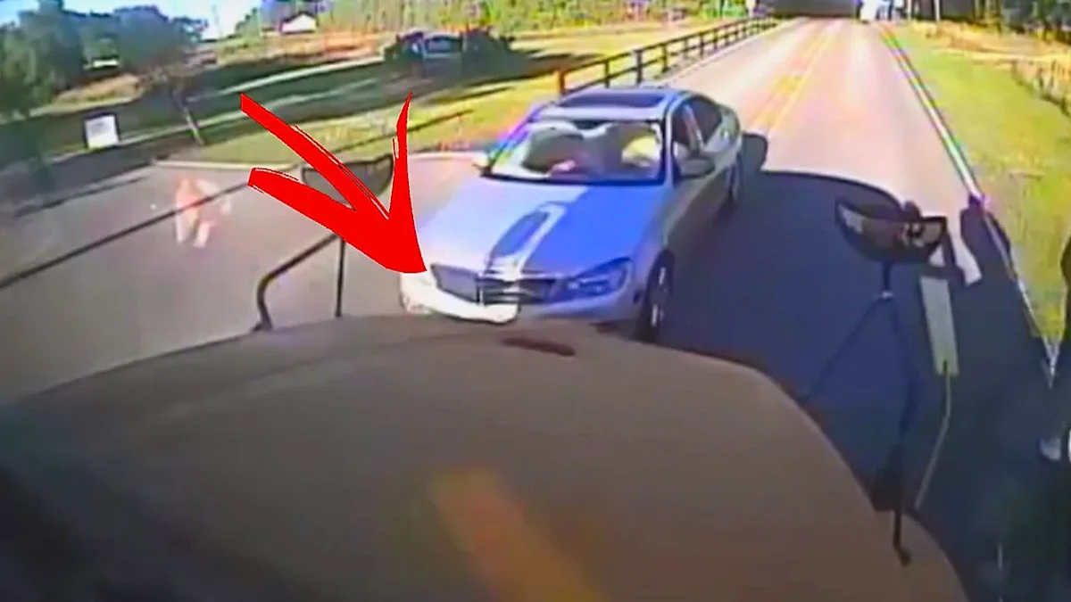 A school bus with significant damage after being smashed into by a reckless driver, highlighting the importance of road safety and the need for stricter traffic laws