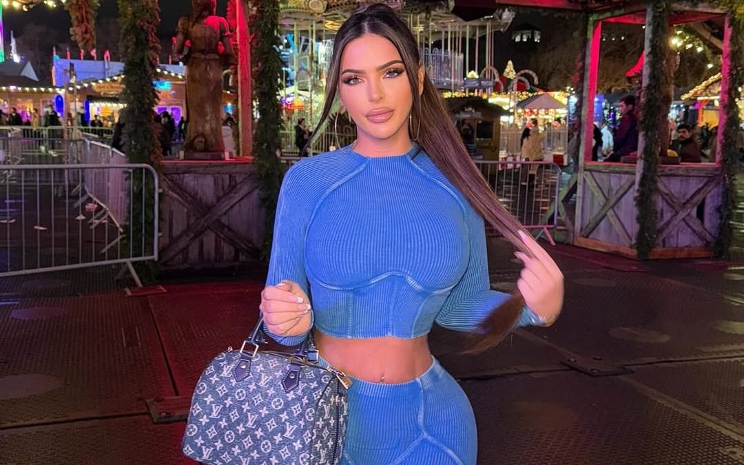 A photo of a car crash in Soho, with a young influencer who died in the incident, surrounded by flowers and tributes from fans and followers, with a colour and energy that will be deeply missed