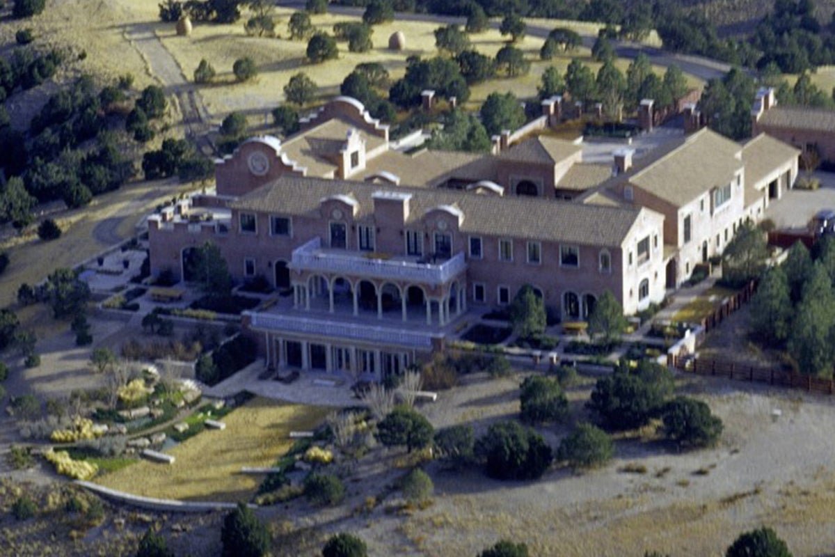 Aerial view of Jeffrey Epstein's New Mexico ranch, a place of darkness and abuse, where the billionaire preyed on vulnerable victims, highlighting the need for justice and accountability, with the primary keyword 'Jeffrey Epstein' featured prominently