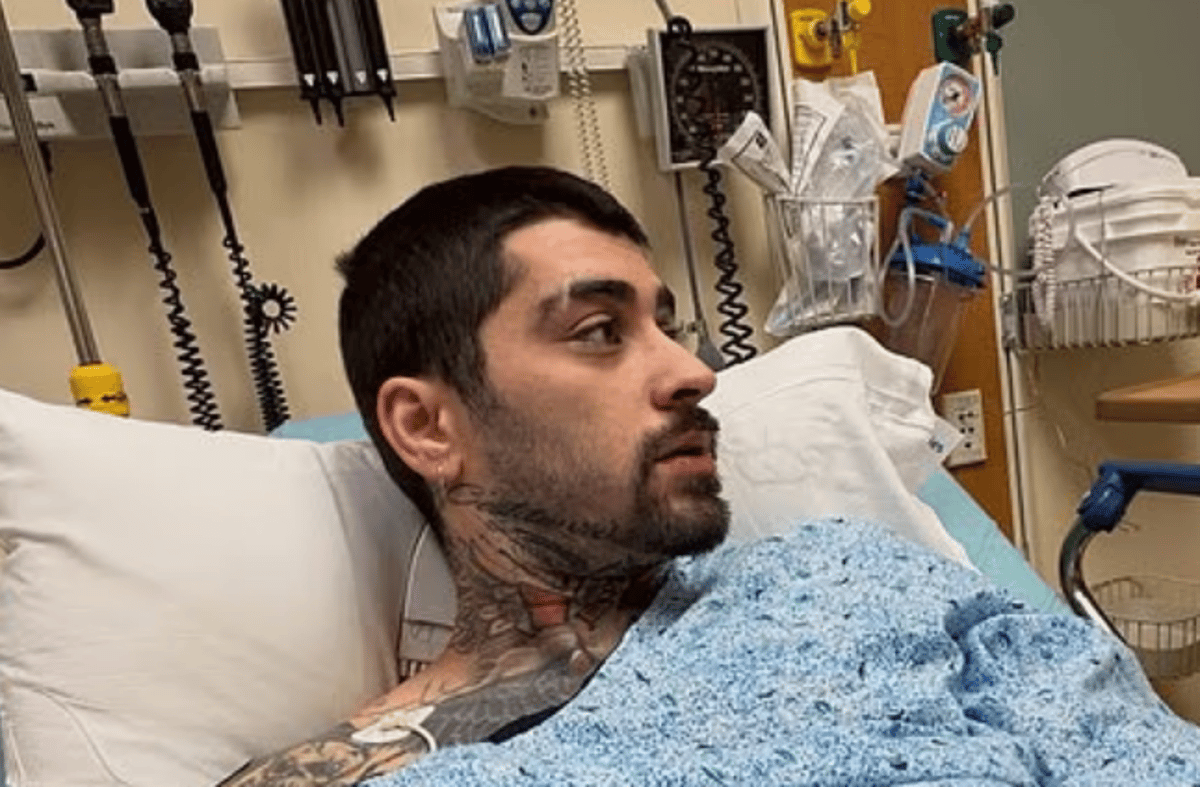 Zayn Malik in hospital, surrounded by medical equipment and personnel, with a look of concern on his face, highlighting his health concerns and the importance of seeking medical expertise