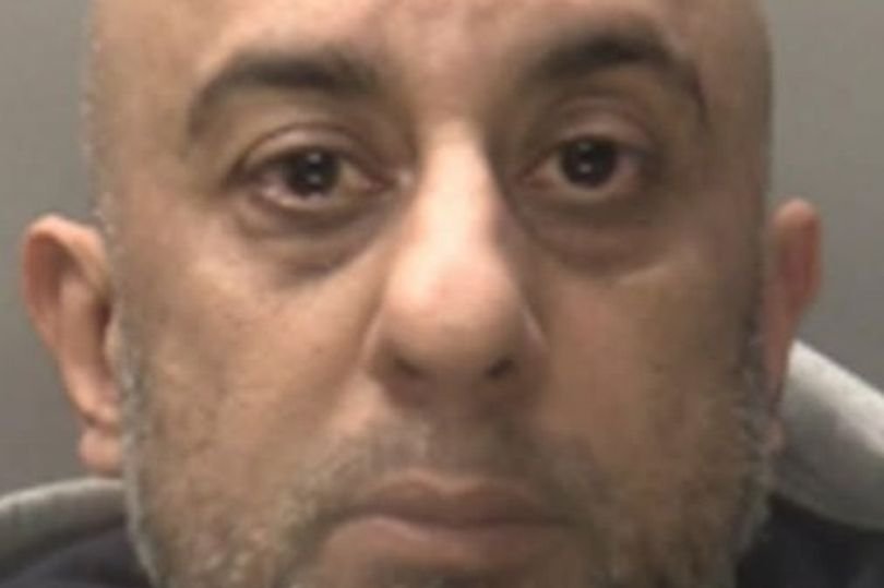 A photo of a person in a courtroom, with a judge and lawyers present, representing the Birmingham man being jailed for online support of a proscribed organisation, a serious offence in the UK
