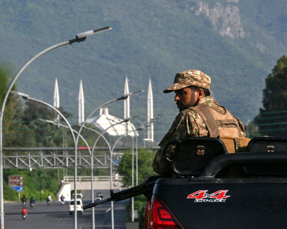 Iranian and US flags waving in the wind, symbolising the complex and delicate nature of their relationship, with a focus on the Iran peace proposal