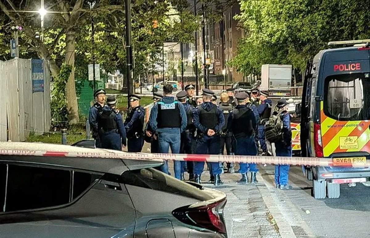 Aerial view of Brixton, south London, with a police cordon in place following a drive-by shooting incident, highlighting the need for community-led initiatives to tackle gun crime and violent behaviour