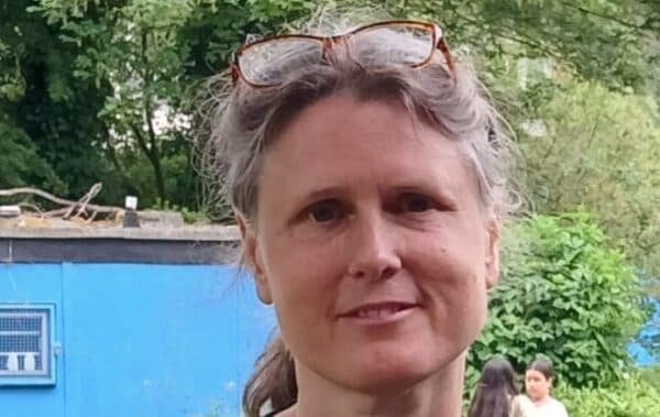 Green Party candidate campaigning in London despite arrest for alleged anti-Semitism, with a focus on social justice and environmental issues, in the heart of the city