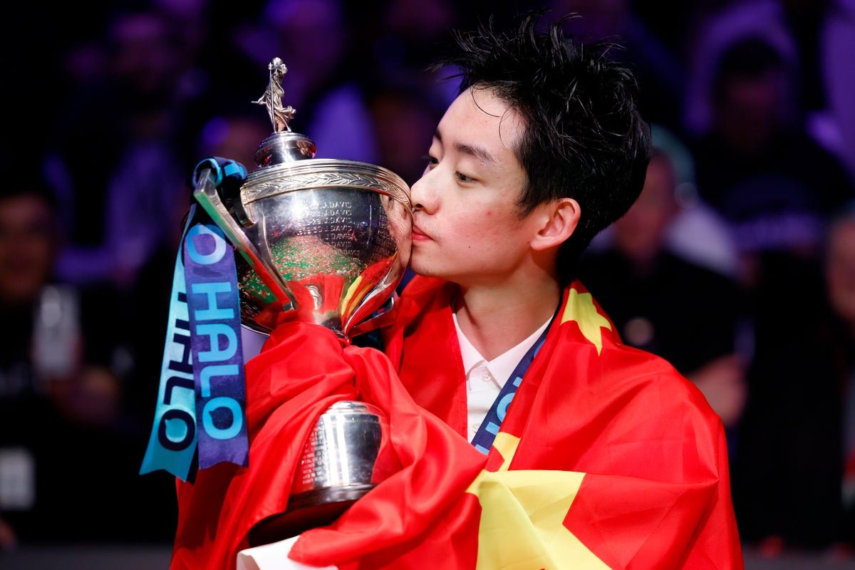 Wu Yize in action at the Crucible, showcasing his exceptional skill and technique as he pots a difficult shot, the crowd watching in awe as he redefines the boundaries of snooker excellence with his remarkable behaviour under pressure and unwavering dedication to the sport