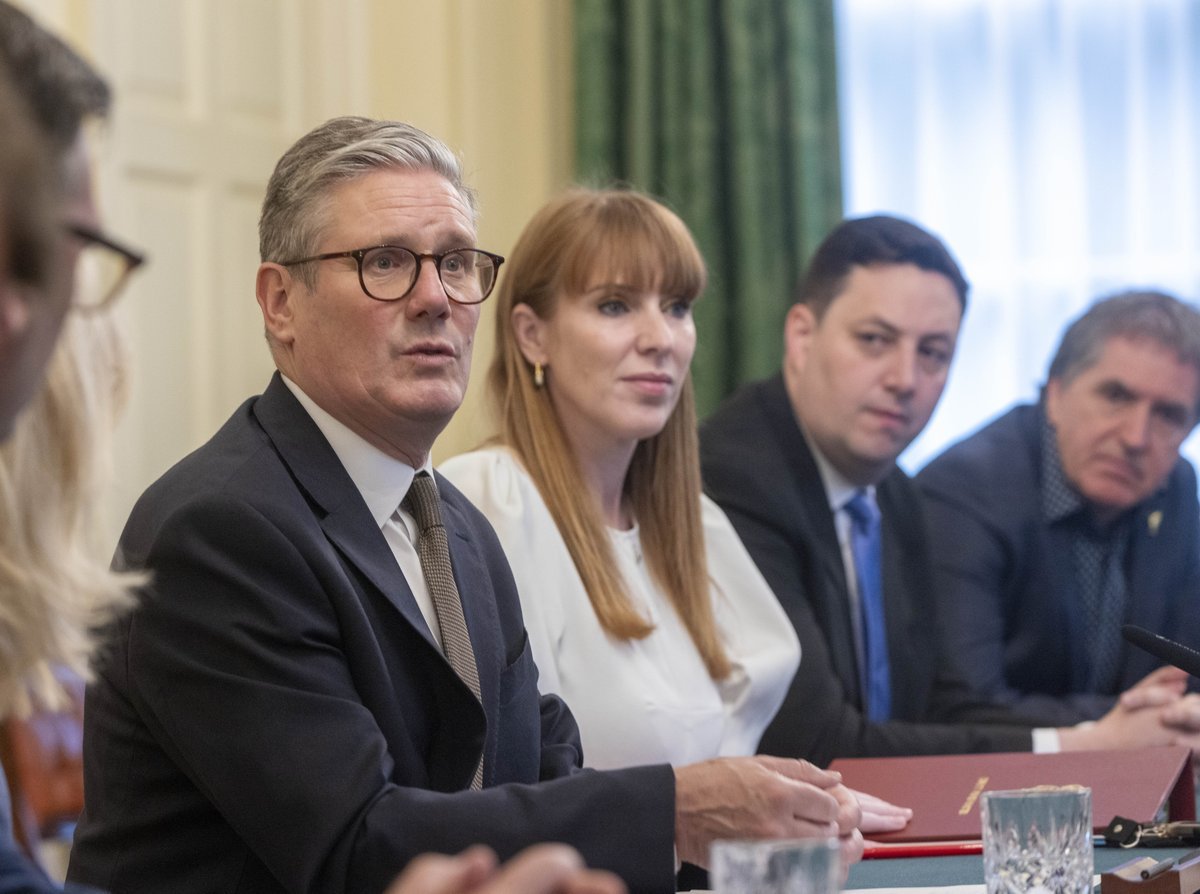 Angela Rayner speaking at a Labour Party conference, with a determined look on her face, as she launches a bombshell attack on Keir Starmer's government, highlighting the need for change in the Labour Party