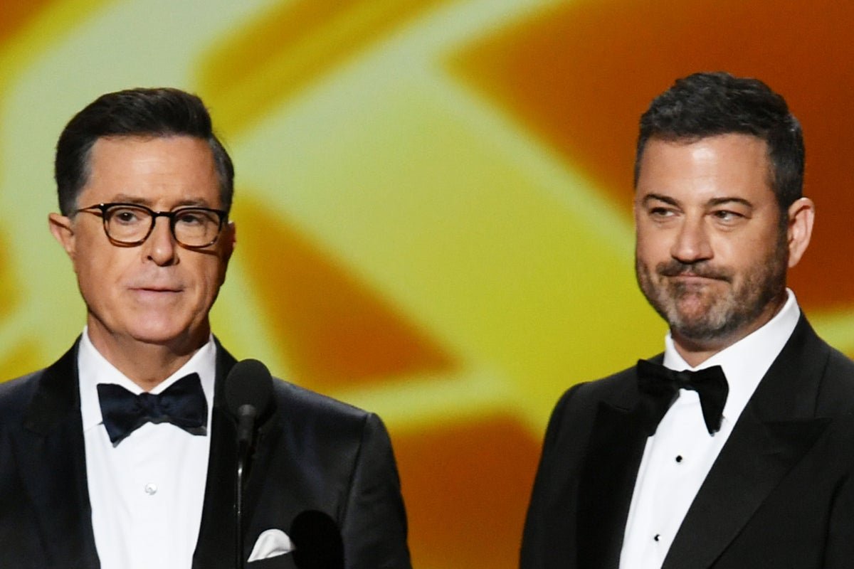 Jimmy Kimmel and Stephen Colbert, two late-night hosts, pose together, reflecting their mutual respect and admiration for each other's work in the competitive yet respectful world of late-night television, with a background that highlights the colour and energy of their shows
