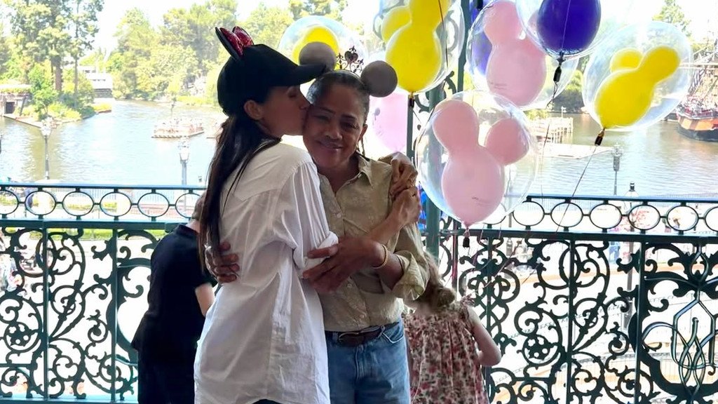 The Duchess of Sussex and her family enjoy a fun-filled day at Disneyland, surrounded by colourful attractions and exciting experiences, with the primary keyword being royal family