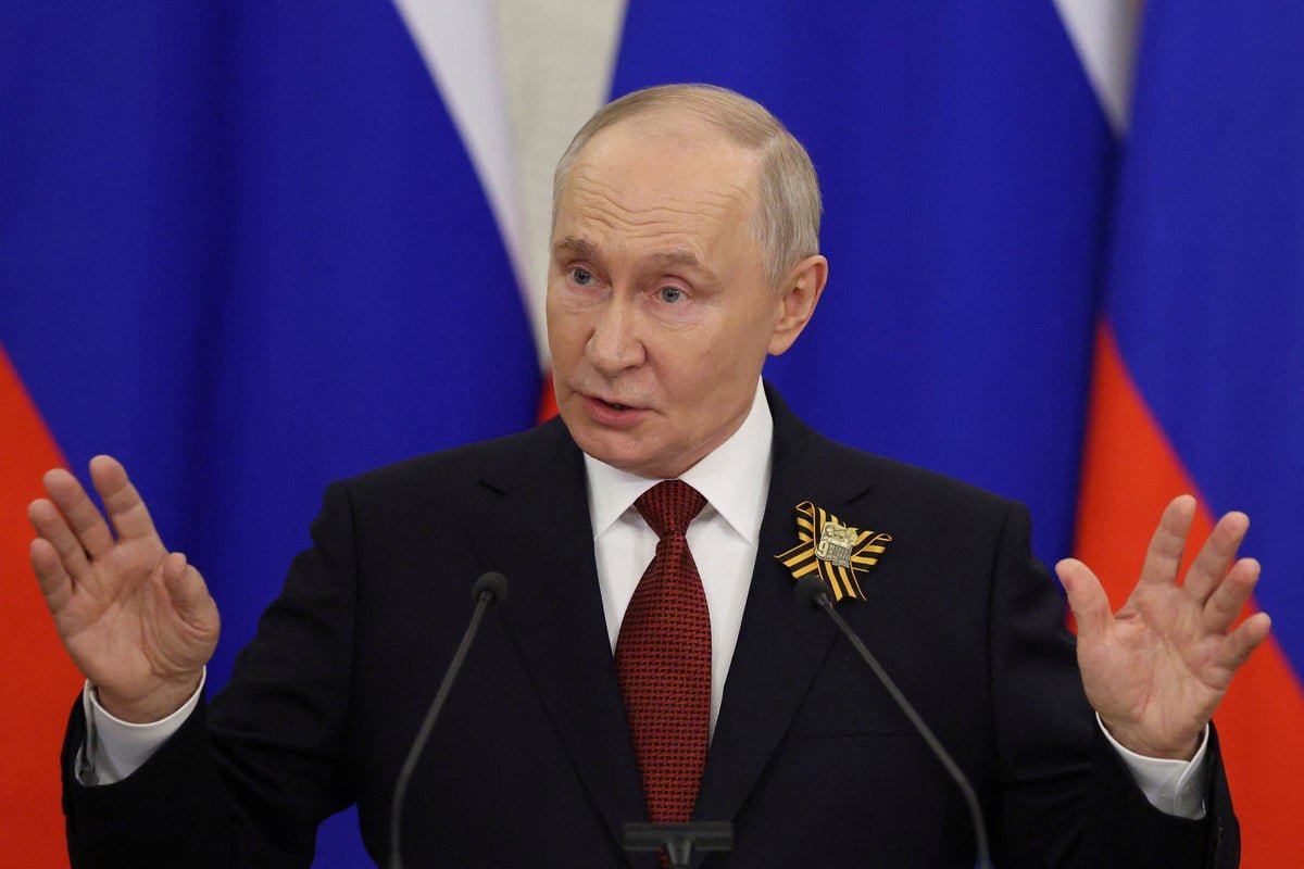Russian President Vladimir Putin speaking at a press conference, with a serious expression, as the conflict between Russia and Ukraine continues to escalate, with a focus on the war in Ukraine