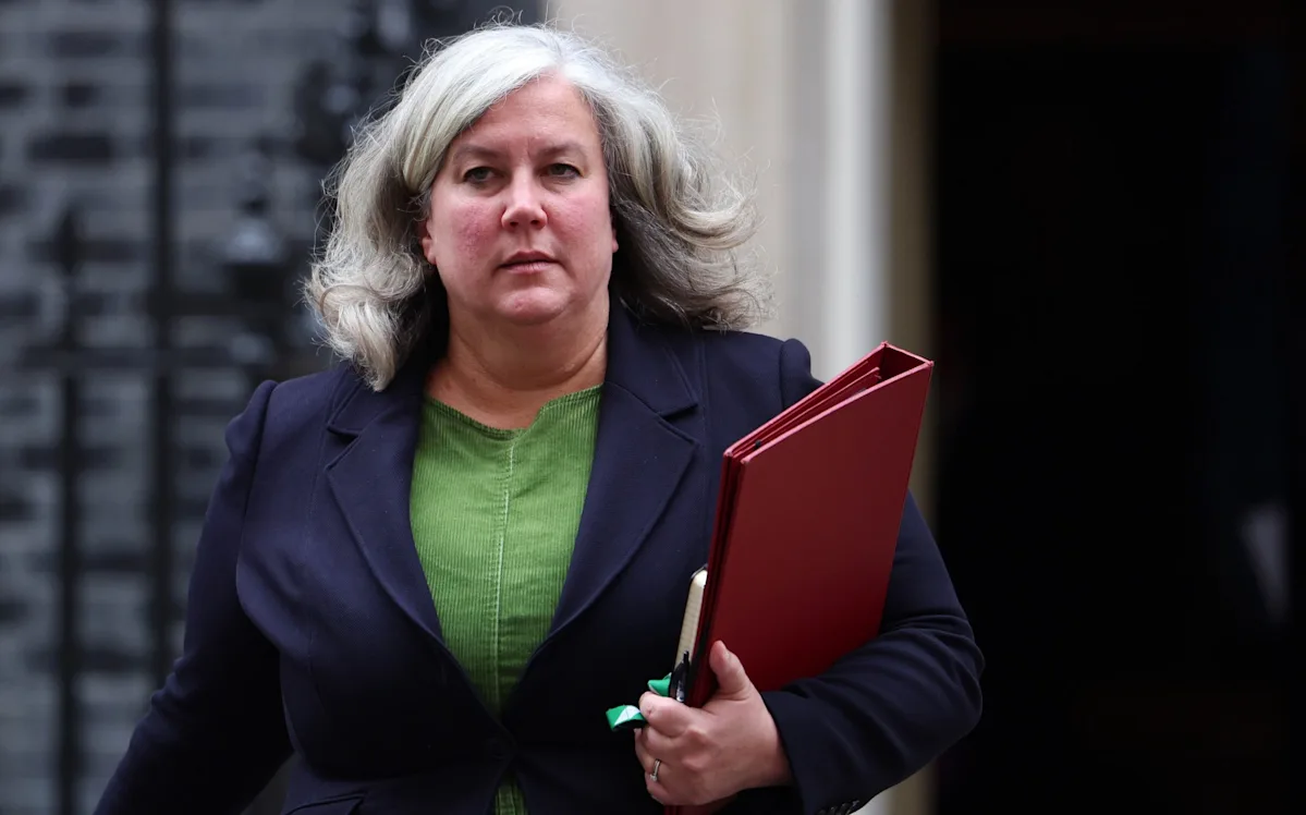 A car being towed after hitting a pothole, with a focus on the damaged wheel and the pothole in the background, highlighting the need for improved road maintenance and repairs in the UK, with the primary keyword being pothole