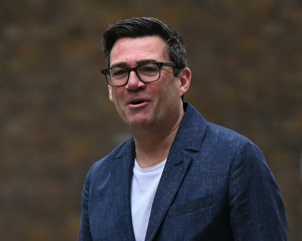 Andy Burnham, a British politician, standing firm with his allies in parliament, symbolising his determination to make a comeback, with a cityscape in the background, representing the colour and complexity of British politics