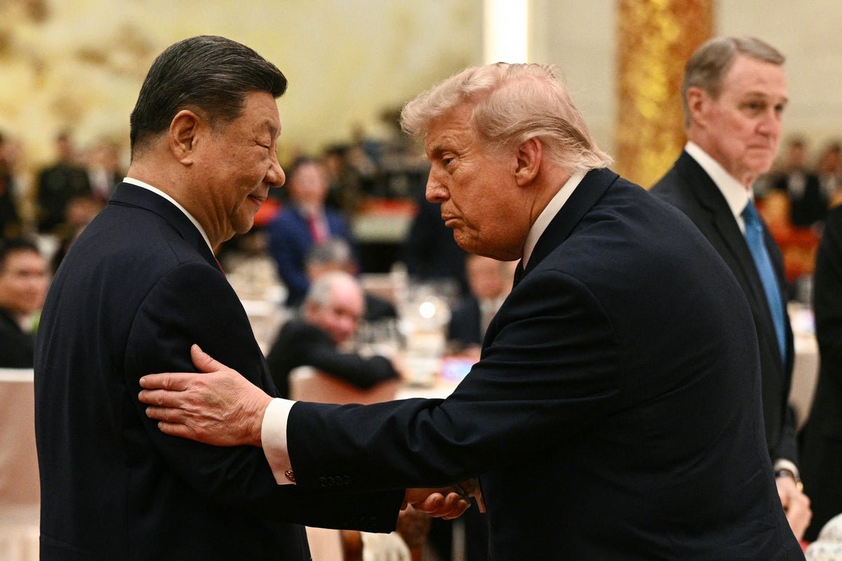 Chinese and US flags waving in the wind, symbolising the complex and evolving nature of their diplomatic relationship, with a focus on China US relations