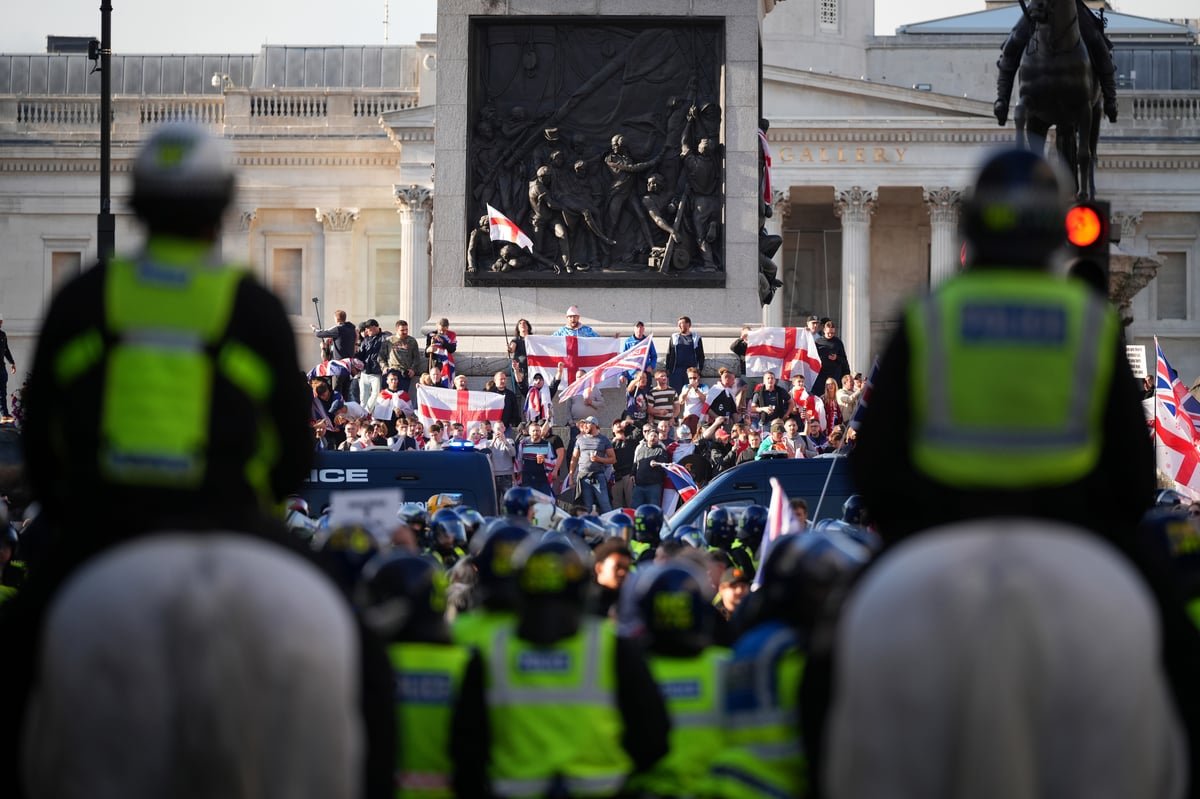 A large crowd of football fans and protesters gather in London, with police officers deployed to maintain order and prevent football yob violence, as the city prepares for the FA Cup Final and the Tommy Robinson-led march, with a primary focus on preventing disorder and ensuring public safety