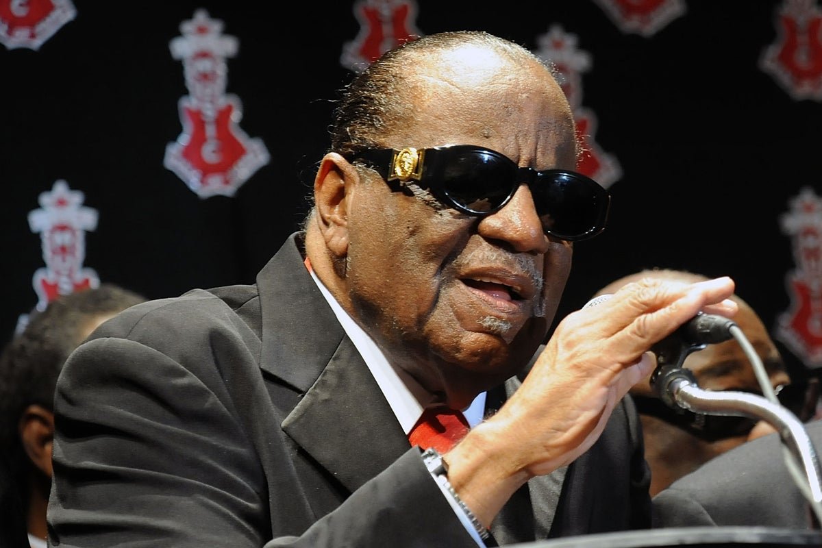 Clarence Carter, the legendary singer behind the hit song 'Strokin'', performing on stage with his unique soulful voice and charismatic behaviour, leaving a lasting legacy in the music industry with his colourful blend of soul, R&B, and blues
