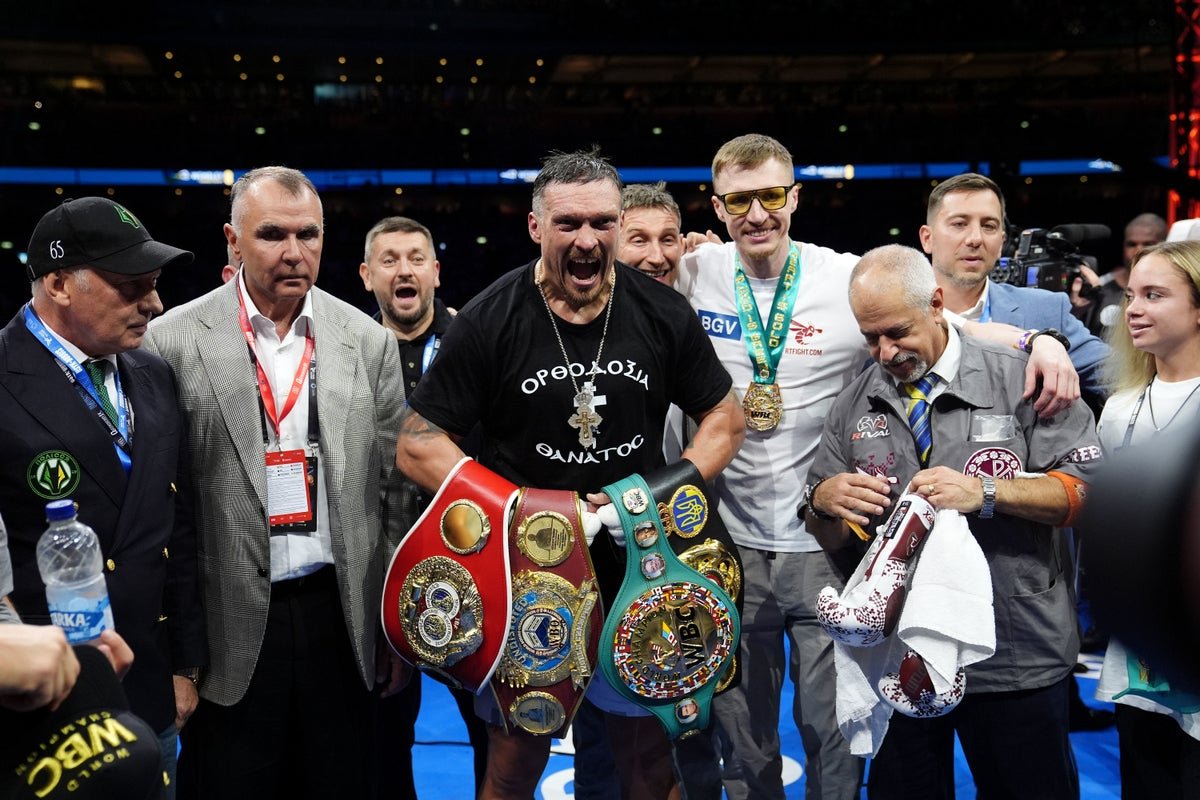 Oleksandr Usyk and Rico Verhoeven face off in the ring, with the IBF title ruling looming in the background, adding an extra layer of complexity to the highly anticipated boxing match, with the colour and energy of the crowd electric
