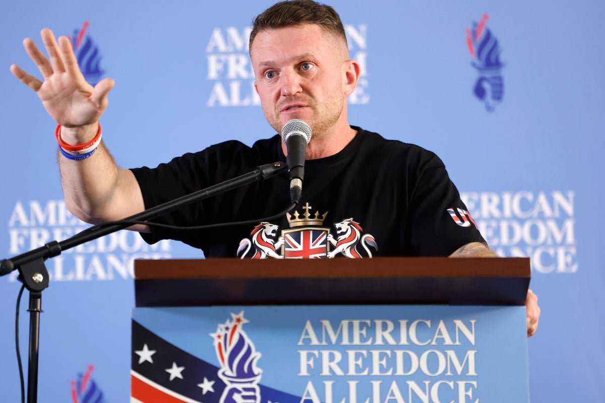 Tommy Robinson stands at a podium, surrounded by a diverse crowd of people, with a London backdrop, highlighting the primary keyword of Unite the Kingdom march