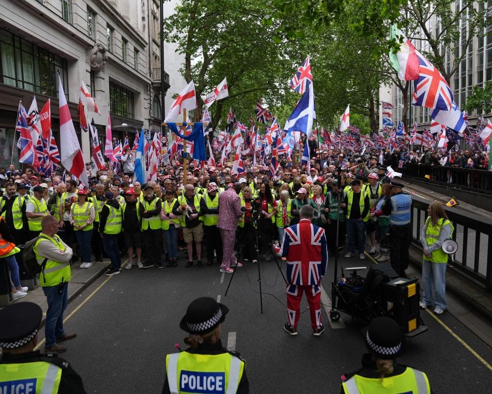 Tommy Robinson addressing a massive rally in London, with tens of thousands of supporters preparing for the 'battle of Britain'