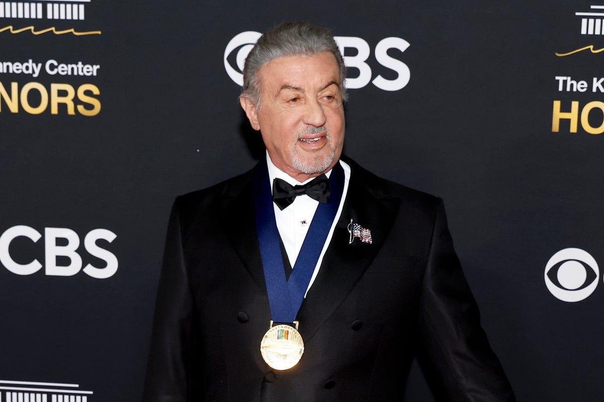 Sylvester Stallone at the 1977 Oscars, a memorable moment in his career as a Hollywood actor and filmmaker, with his film Rocky nominated for several awards, showcasing his talent and behaviour as a renowned actor