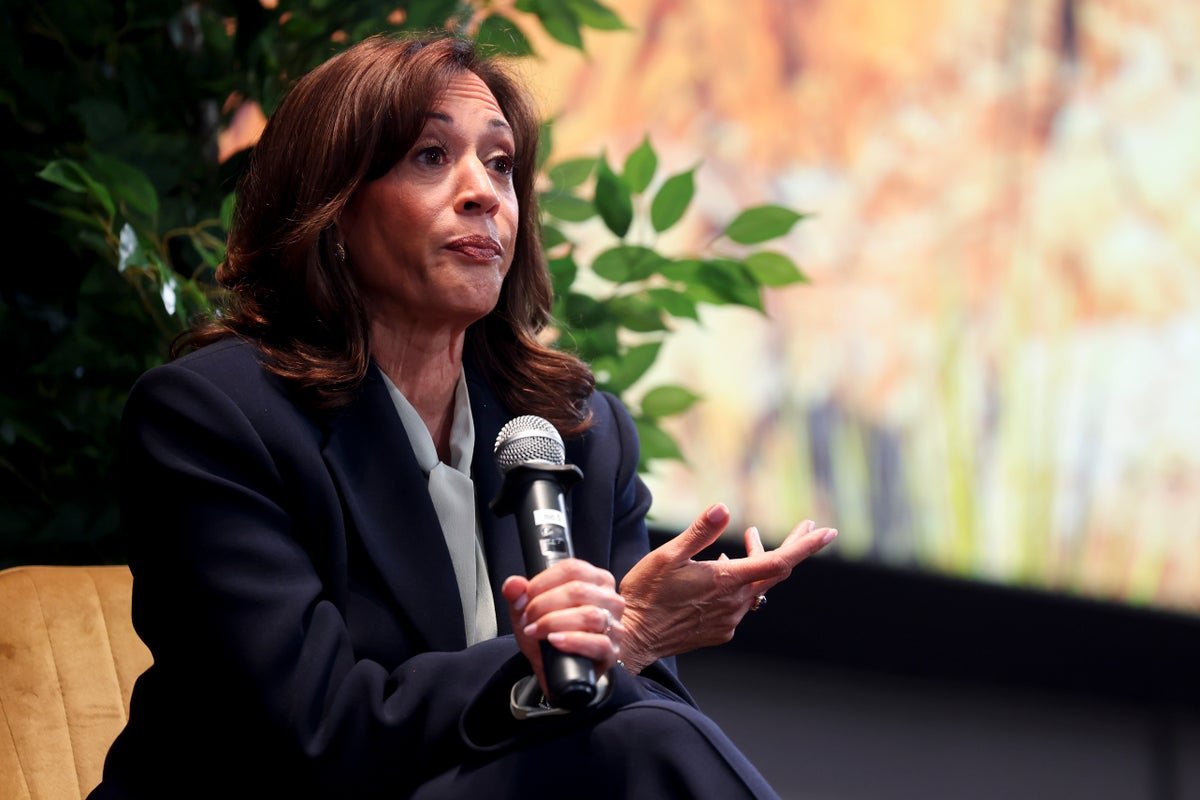 Kamala Harris speaking at a podium, with a backdrop of the US Supreme Court building, highlighting her support for Supreme Court expansion to prevent red state cheating and promote a fairer justice system